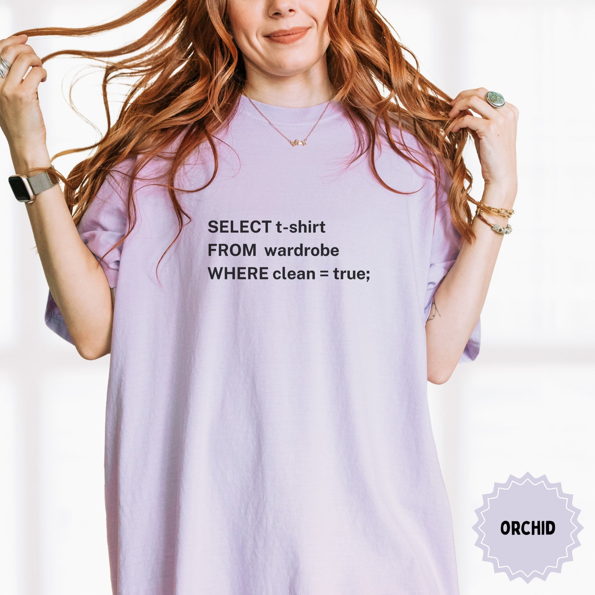 Light purple t-shirt with "SELECT t-shirt FROM wardrobe WHERE clean = true;" text.
