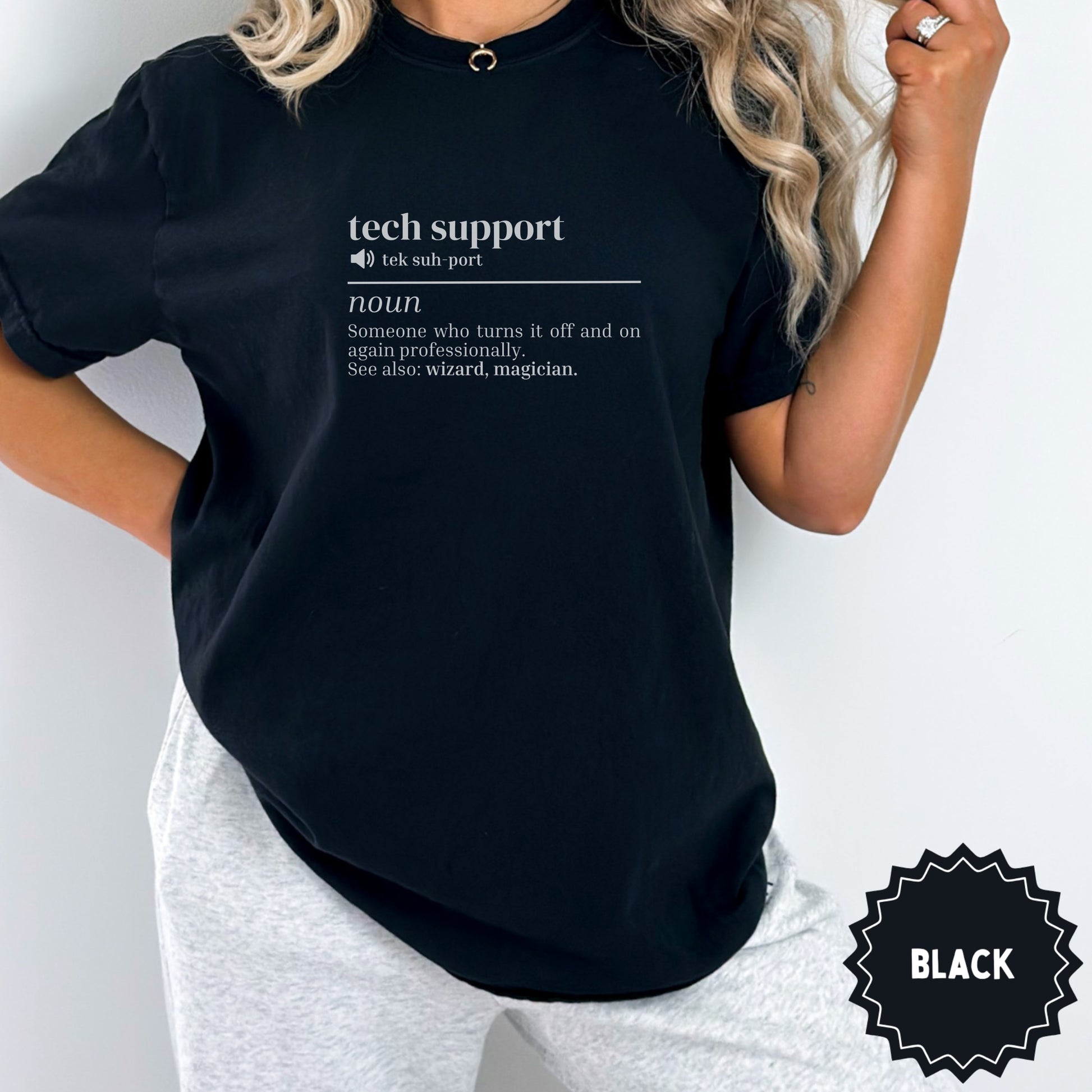 Black t-shirt with "tech support" definition: turns it off and on again.