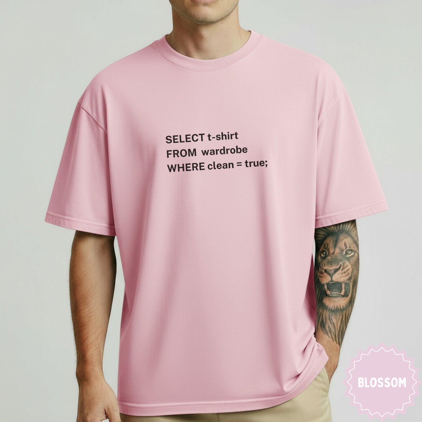 Pink t-shirt with "SELECT t-shirt FROM wardrobe WHERE clean = true;" text.