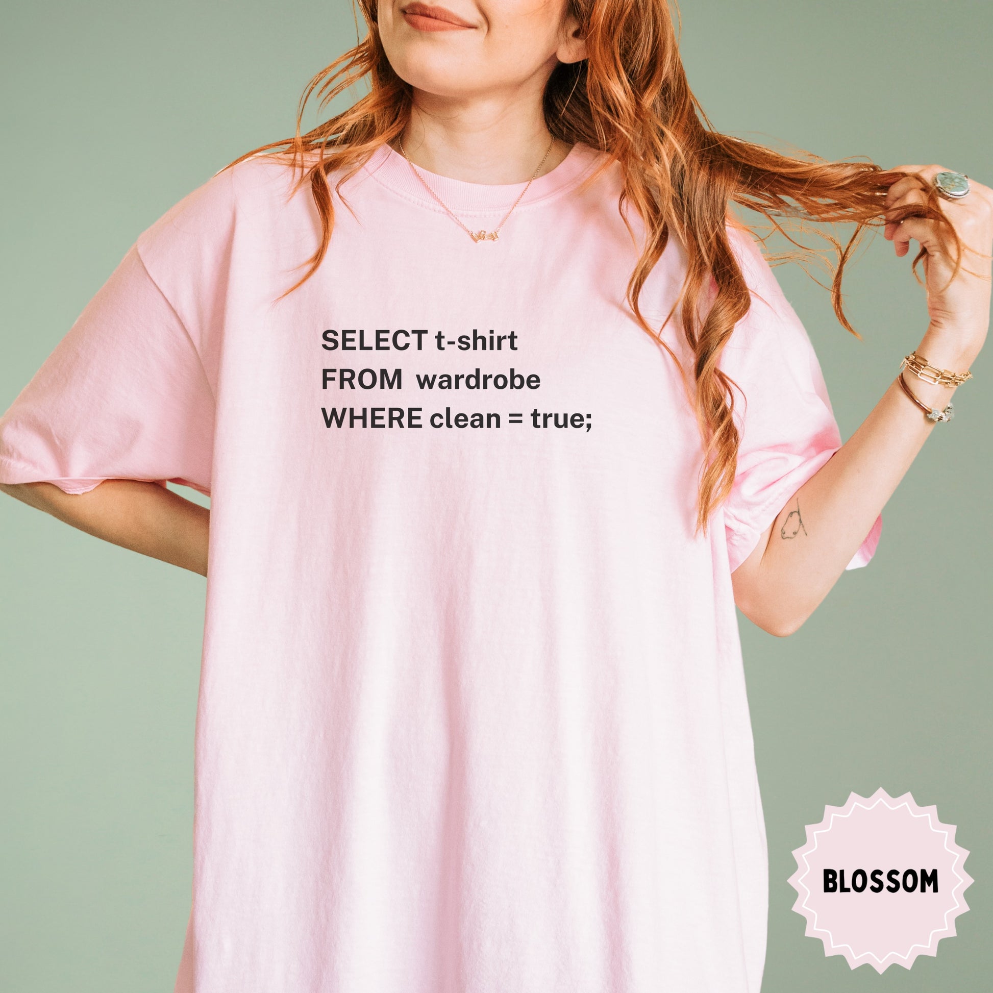 Light pink t-shirt with programming code "SELECT t-shirt FROM wardrobe WHERE clean = true; BLOSSOM"