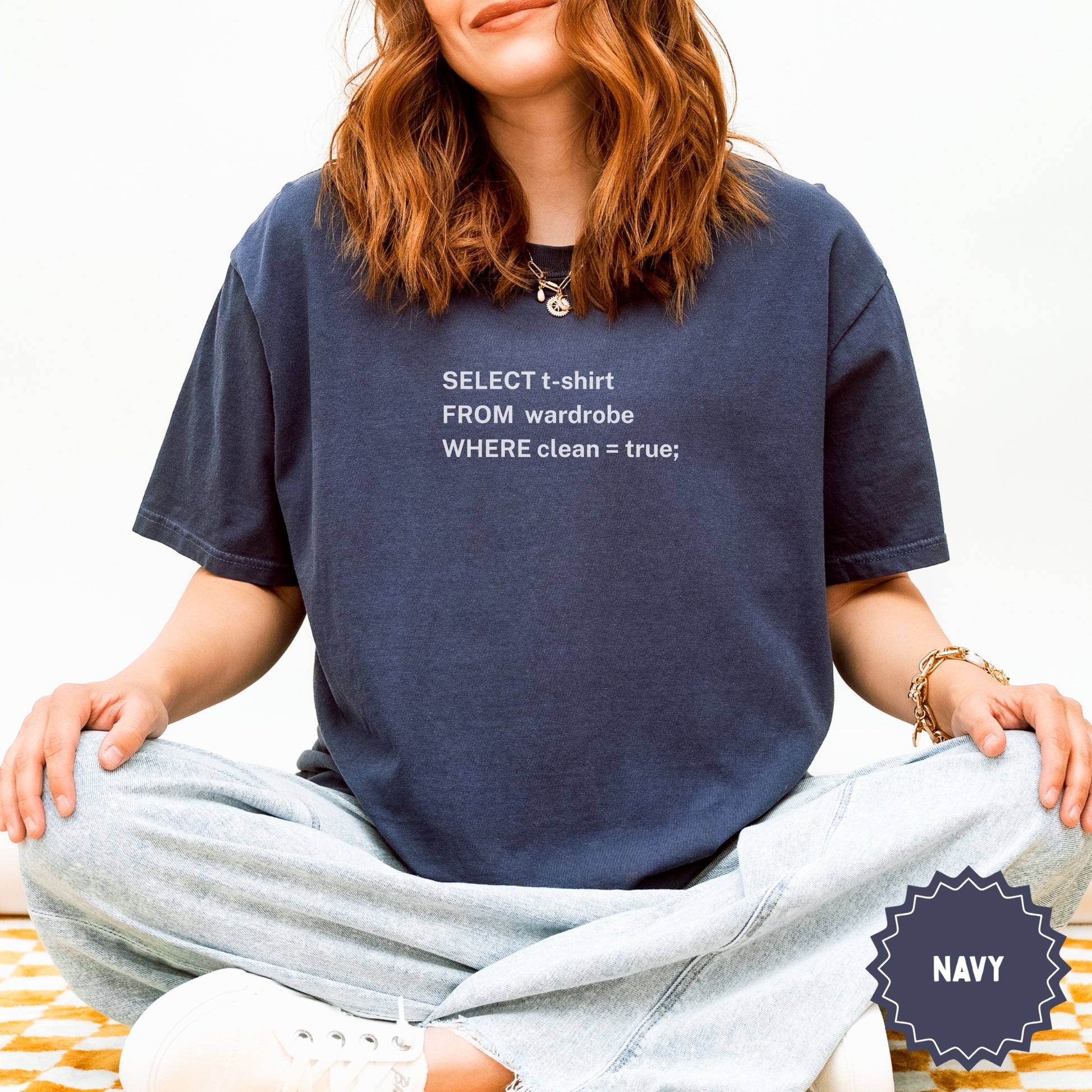 Navy t-shirt with "SELECT t-shirt FROM wardrobe WHERE clean = true;" text.