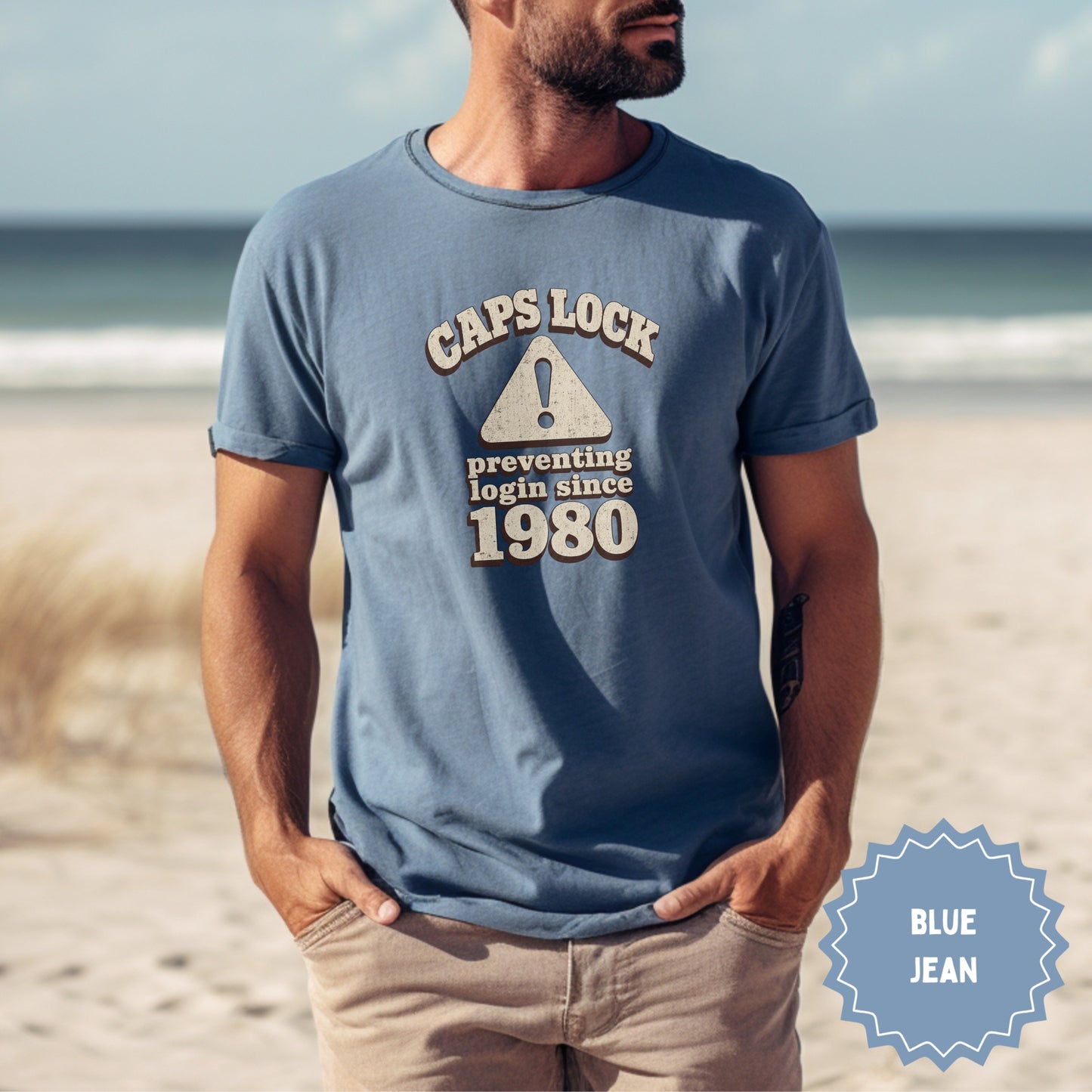 Blue t-shirt with "CAPS LOCK preventing login since 1980" text.