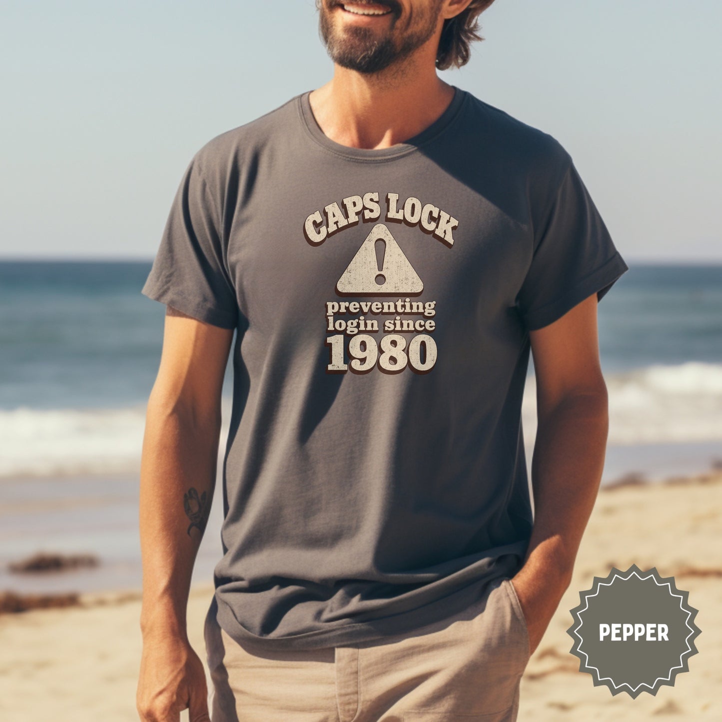 Dark grey t-shirt with "CAPS LOCK preventing login since 1980" text.