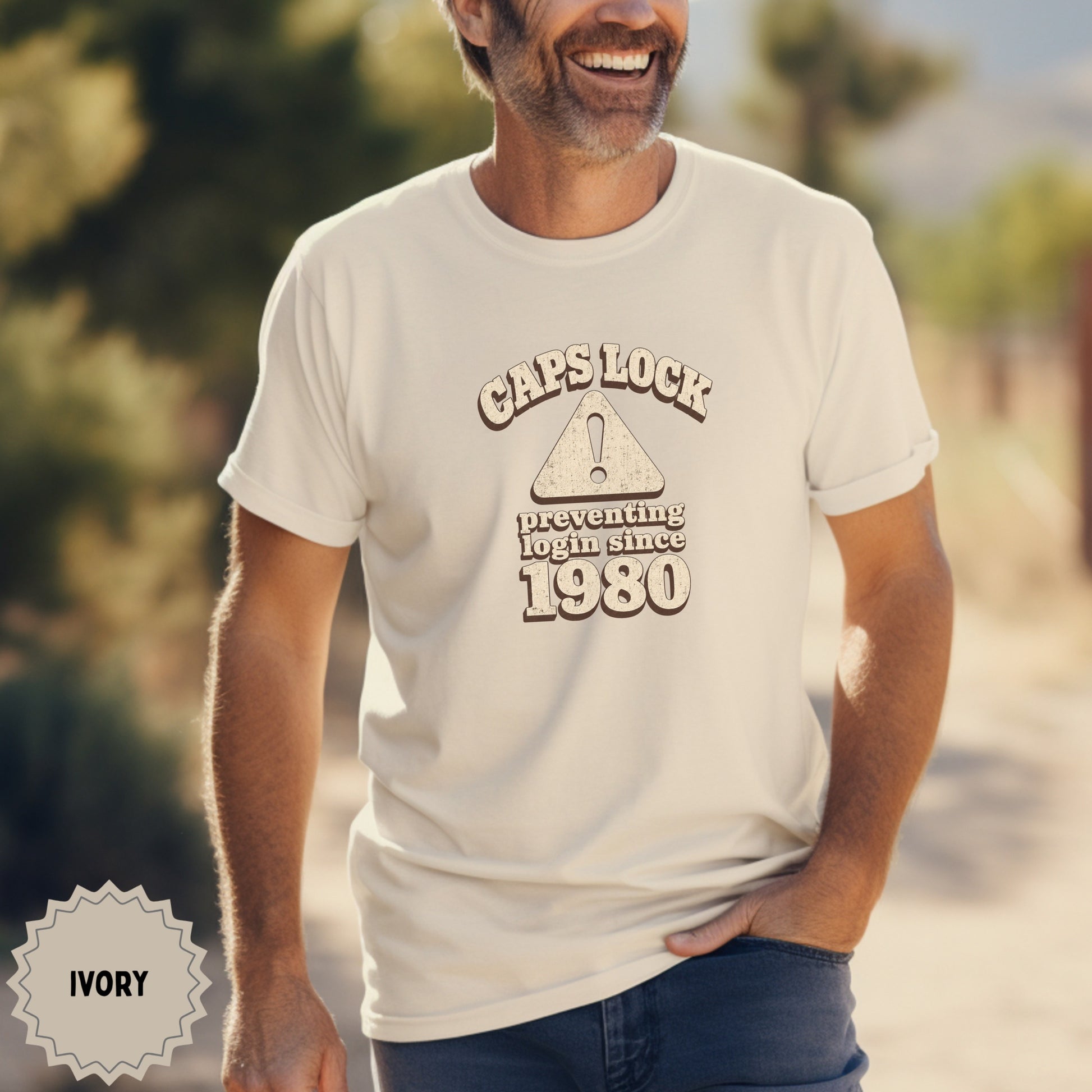 Cream t-shirt with text "Caps Lock Preventing Login Since 1980".
